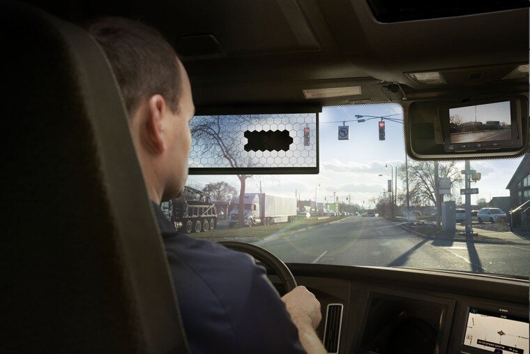 Truck driver using Bosch's new sun visor concept.