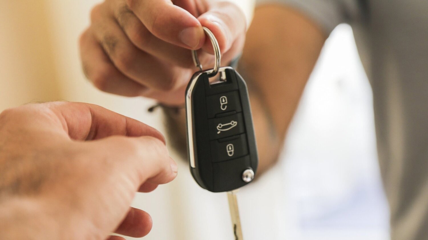 Man lending his car to a friend