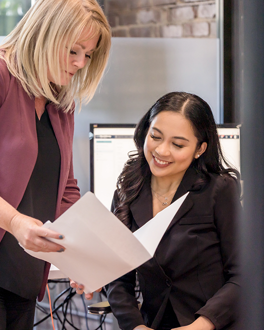 Employees looking at personal injury files together